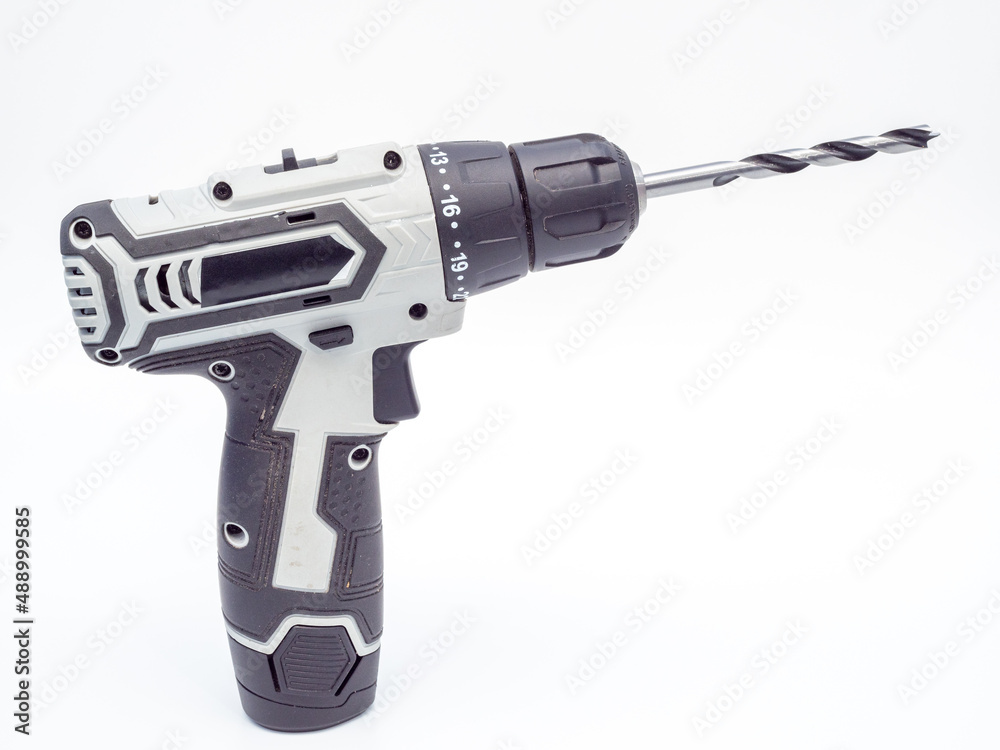 Screwdriver with a drill on a white background Screwdriver with a drill on a white background