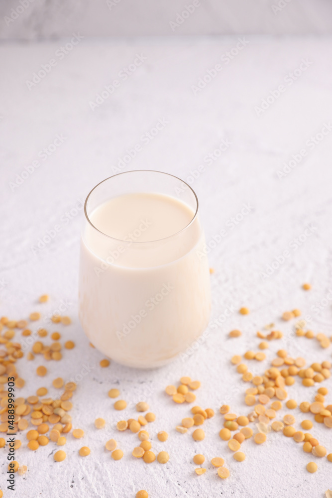 Soy milk in glass and soy bean isolated in white background Soy milk in glass and soy bean isolated in white background