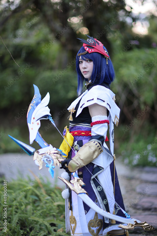 Japanese young woman hunter cosplay with bow on Japanese garden Stock-foto  | Adobe Stock