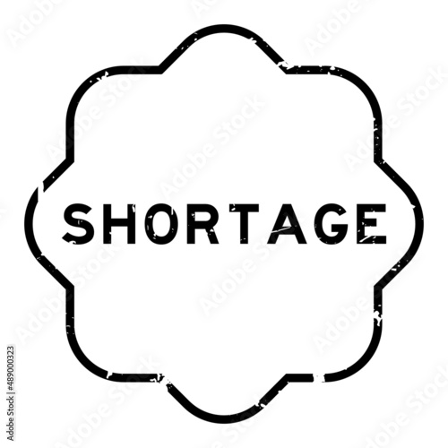 Grunge black shortage word rubber seal stamp on white background