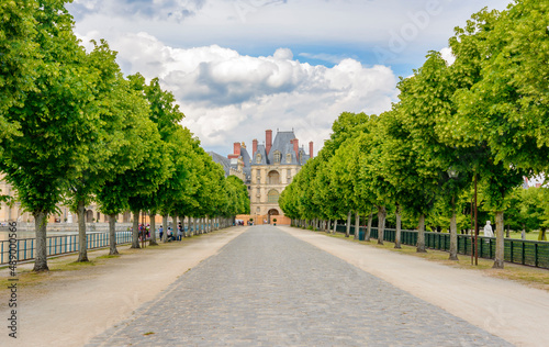 Alley to Fontainebleau palace (Chateau de Fontainebleau) in Paris suburbs, France photo