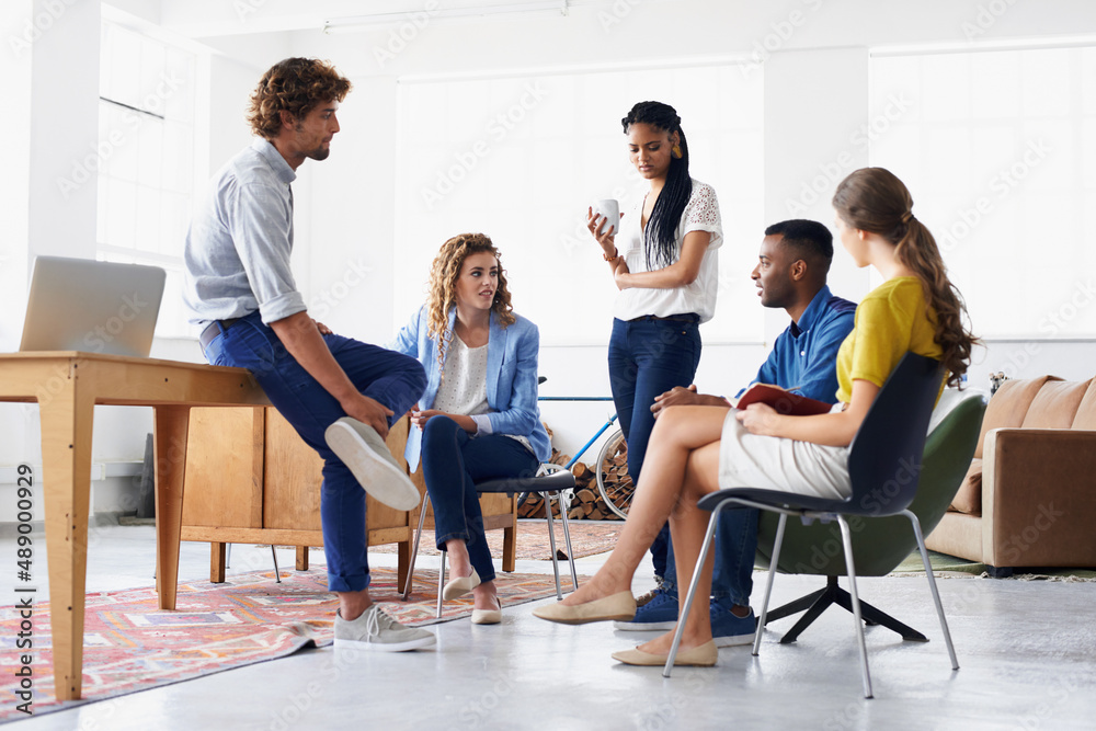Working together for better results. Young people chatting in the office. Working together for better results. Young people chatting in the office.