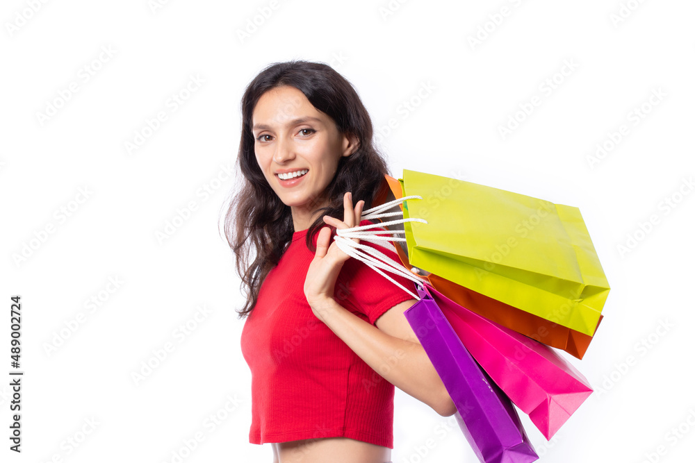 Shopping woman holding shopping bags. Beautiful charming woman with many shopping bags brand name product that shop has discount. 