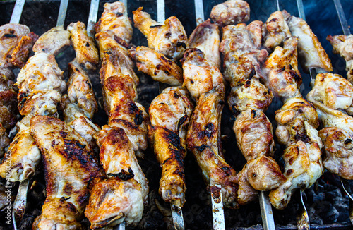 shish kebab of chicken on skewers is fried on coals. It looks appetizing and delicious, and the aroma plays up the appetite