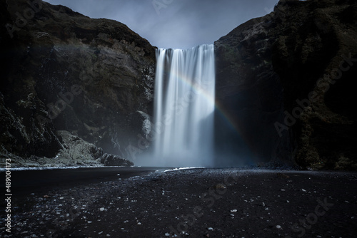 The majestic Skogafoss waterfall and a rainbow in Iceland