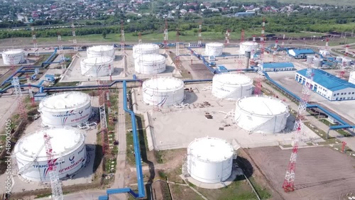 Base for storage of oil and oil products. Lots of tanks with lots of barrels of oil. Strategic object. The video was taken from a drone.