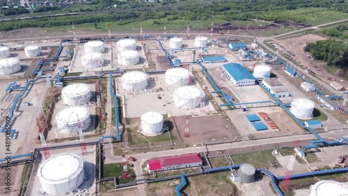 Base for storage of oil and oil products. Lots of tanks with lots of barrels of oil. Strategic object. The video was taken from a drone.