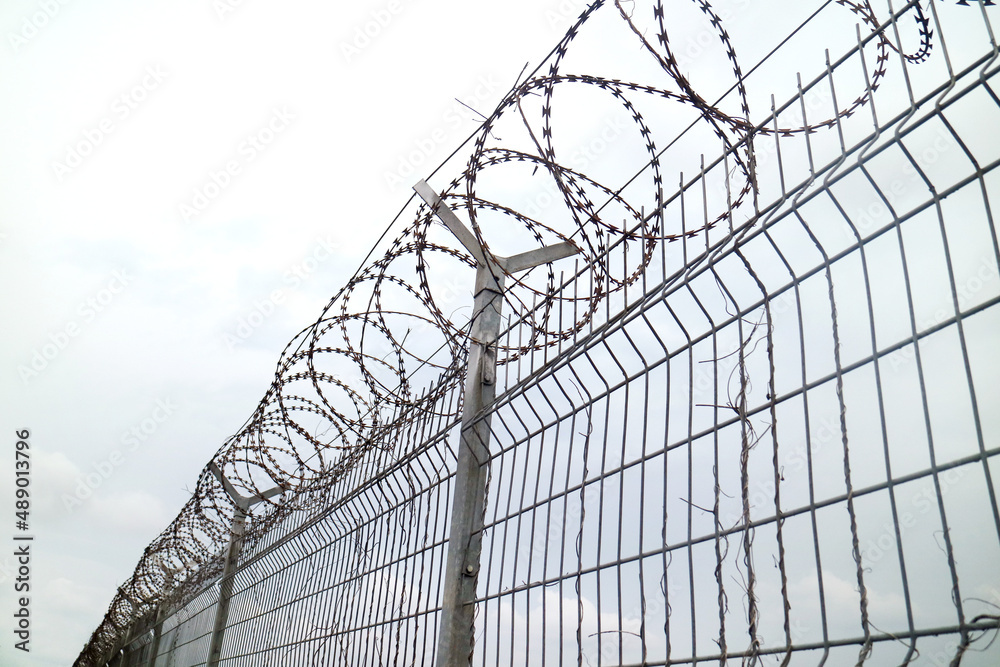 Wire Fence Airport with white sky Wire Fence Airport with white sky