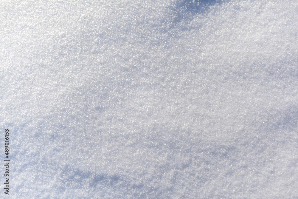 Clean, white snow close-up. Winter background. Snow surface. Fresh fluffy white snow texture.White snowflakes. High quality photo Clean, white snow close-up. Winter background. Snow surface. Fresh fluffy white snow texture.White snowflakes. High quality photo
