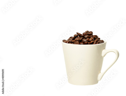coffee beans in a coffee mug. roasted arabica coffee beans. 
