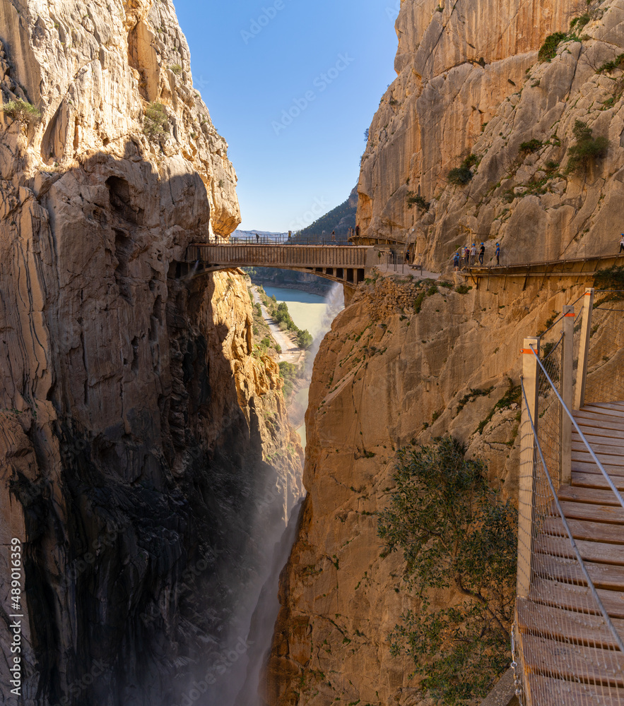 Fototapeta premium tourists enjoy hiking the Camino del Rey on a bautiful winter day