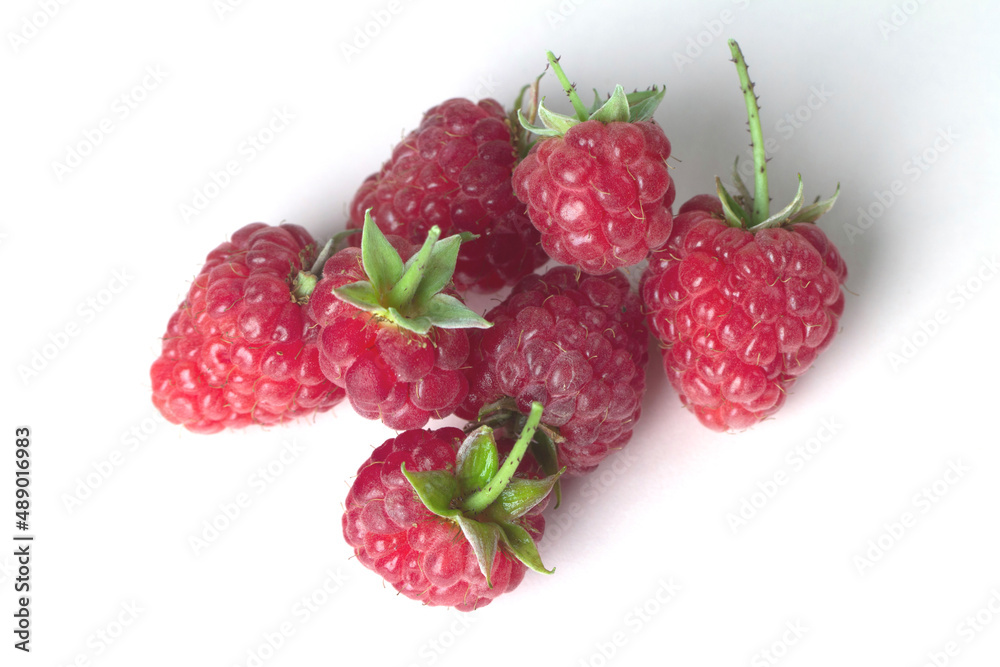 Ripe garden raspberries isolated on a white background. Ripe garden raspberries isolated on a white background.