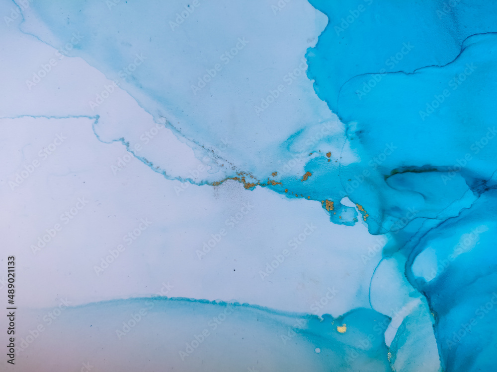 Background texture of alcohol ink in blue color.  Abstract  paint with drops and stains.
