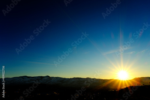 Sunstar at Sunset or Sunrise in Beautiful Blue Sky