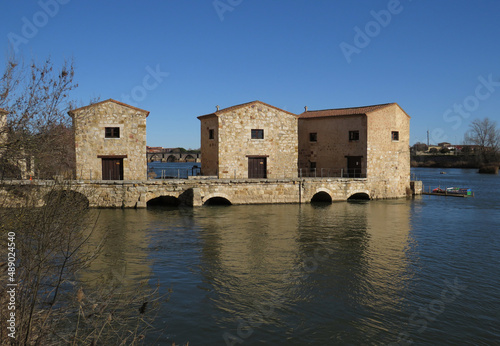 View of the Romanesque water mills of Olivares on the Duero river (11-12 century). Historic city of Zamora. Spain.