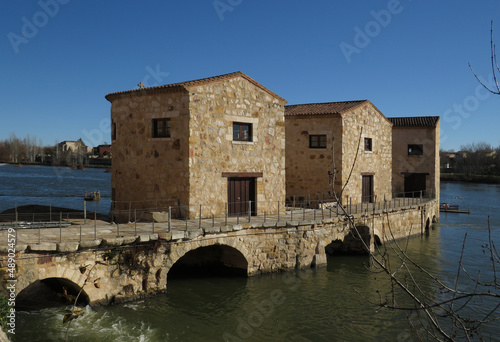 View of the Romanesque water mills of Olivares on the Duero river (11-12 century). Historic city of Zamora. Spain.