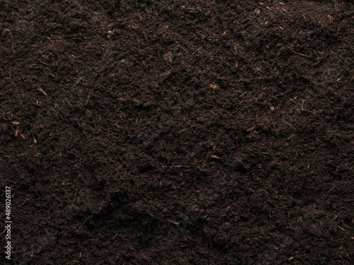 Texture of a planting bed or peat free potting soil, view from above, garden time or planting time concept background