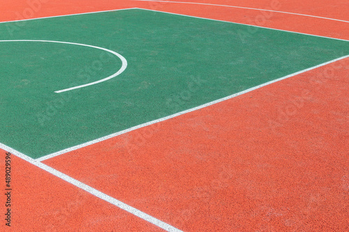Marking on the gum coating of a sports ground for playing basketball. Basketball marking lines background