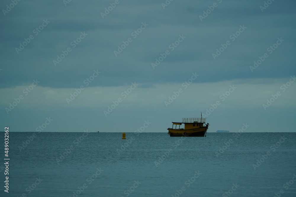 small yellow fishing boat