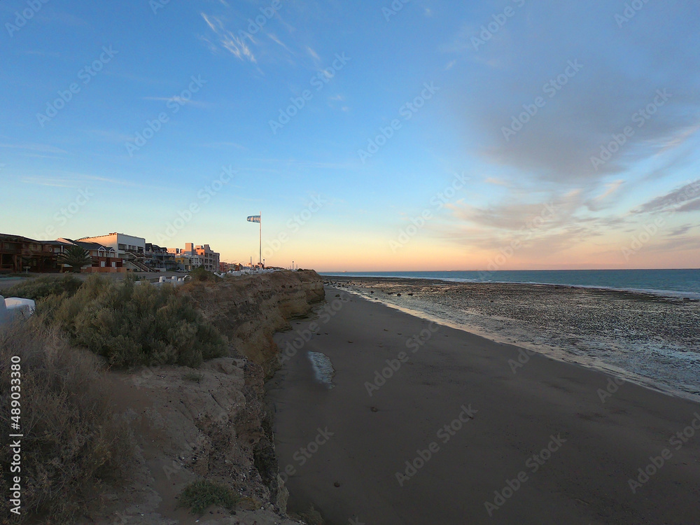 View of the beach of the Argentine town of Las Grutas at sunset