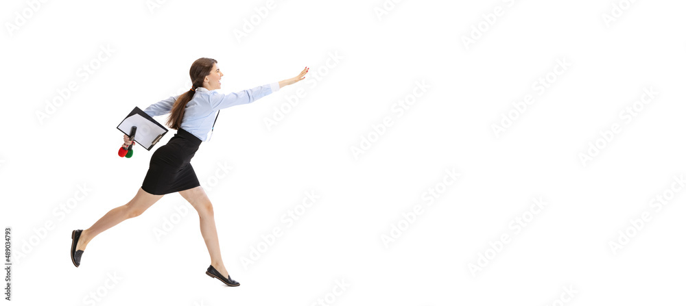 Be late for an interview. Female journalist holding reporter microphone running isolated on white studio background. Concept of social media, press, news, information