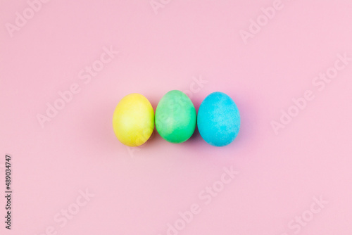 Easter pink composition. Easter eggs on pastel pink background. Minimal concept of Easter.