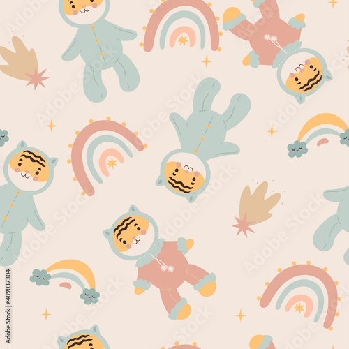 Seamless pattern with cute tiger cubs and rainbows. Vector graphics. © Екатерина Зирина