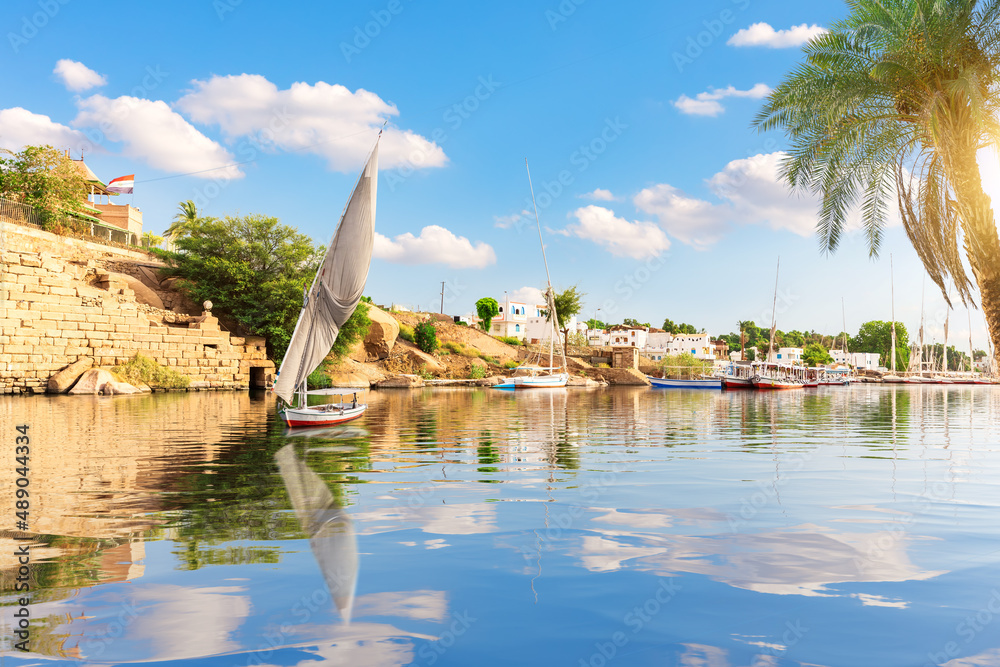The Nile view, sailboat and banks of Aswan, Egypt