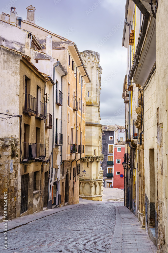 Narrow alley with old houses of many years in the city of Cuenca, Spain.
