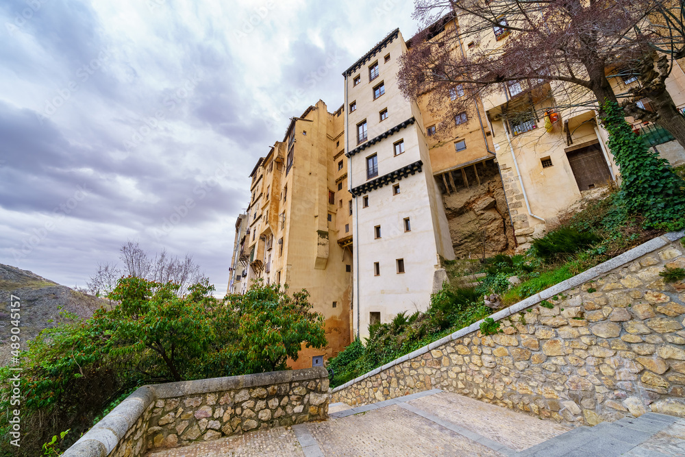 Tall buildings with houses built into the rock cliff, Cuenca Spain.