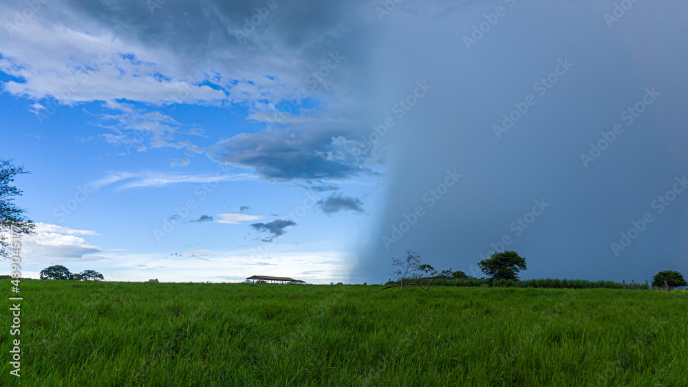 storm coming in a green field