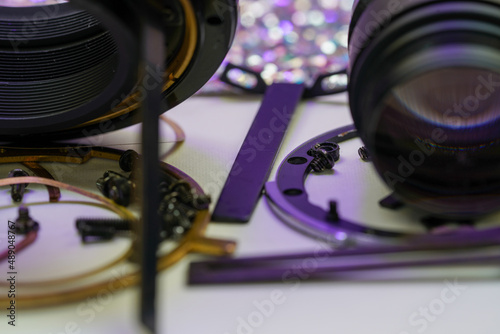 Clean and disassemble the lens for photography into its component parts photo