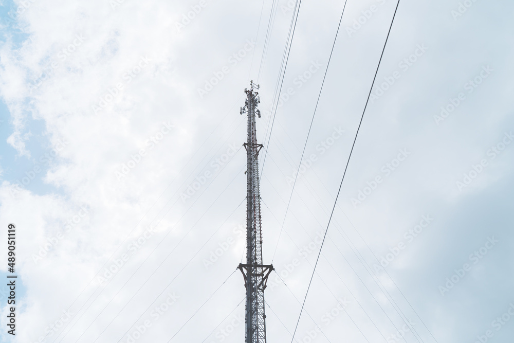 Telecommunication mast TV antennas in the afternoon ,on the hill blue sky with cloud bright at Phuket Thailand. Telecommunication mast TV antennas in the afternoon ,on the hill blue sky with cloud bright at Phuket Thailand.