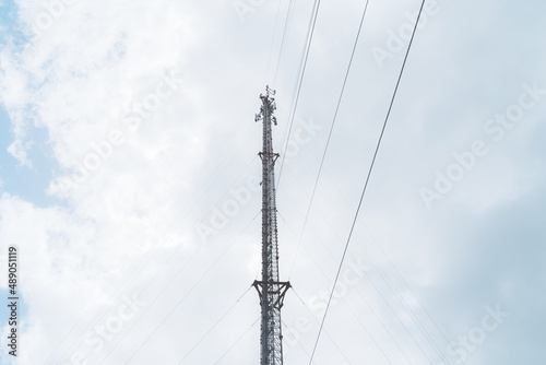 Telecommunication mast TV antennas in the afternoon ,on the hill blue sky with cloud bright at Phuket Thailand.