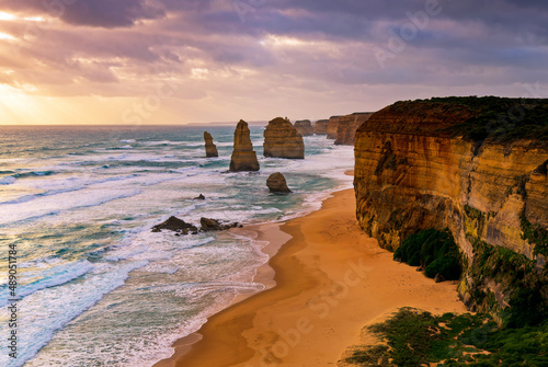 Sunset over Twelves Apostles in Great Ocean Road, Victoria, Australia. The Twelve Apostles is a collection of limestone stacks off the shore of the Port Campbell National Park.