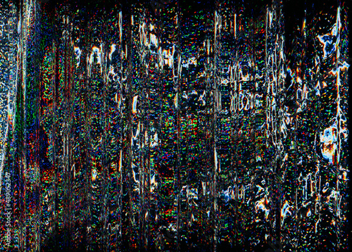 Futuristic glitch. Color noise. Digital distortion. Lcd damage. Blue orange green pixel grain artifact texture on dark black abstract background.