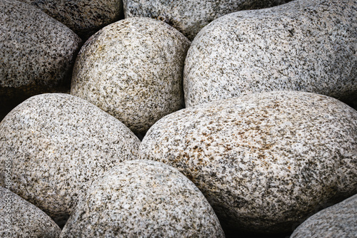 Full frame natural abstract background with round granite stones in vintage style. High resolution image, perfect for interior decoration in Healing by Nature Fine Art Design style. © WDnet Studio