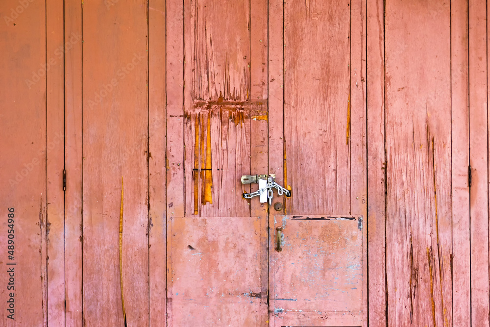 Aged and grunge rustic wood door background with textures Aged and grunge rustic wood door background with textures