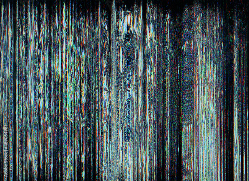 Glitch background. Pixel noise texture. Digital distortion. Transmission error. Colorful artifacts fuzzy pattern on dark blue black overlay. © golubovy