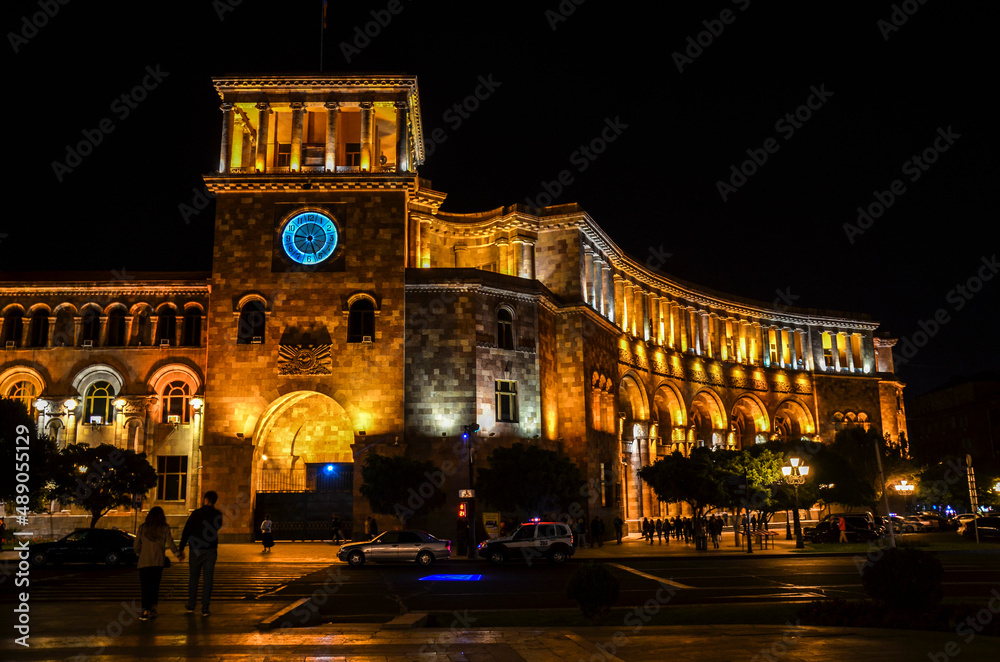 Government building with clock tower located on Republic Square at night. Yerevan, Armenia.