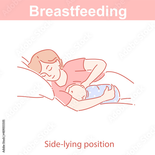 Breastfeeding side-lying position. Woman feeding baby on pillow.