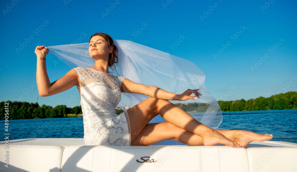 Bride's wedding session on a speedboat. Lake.