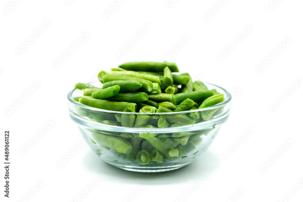 Green beans in glass bowl isolated on white background Green beans in glass bowl isolated on white background