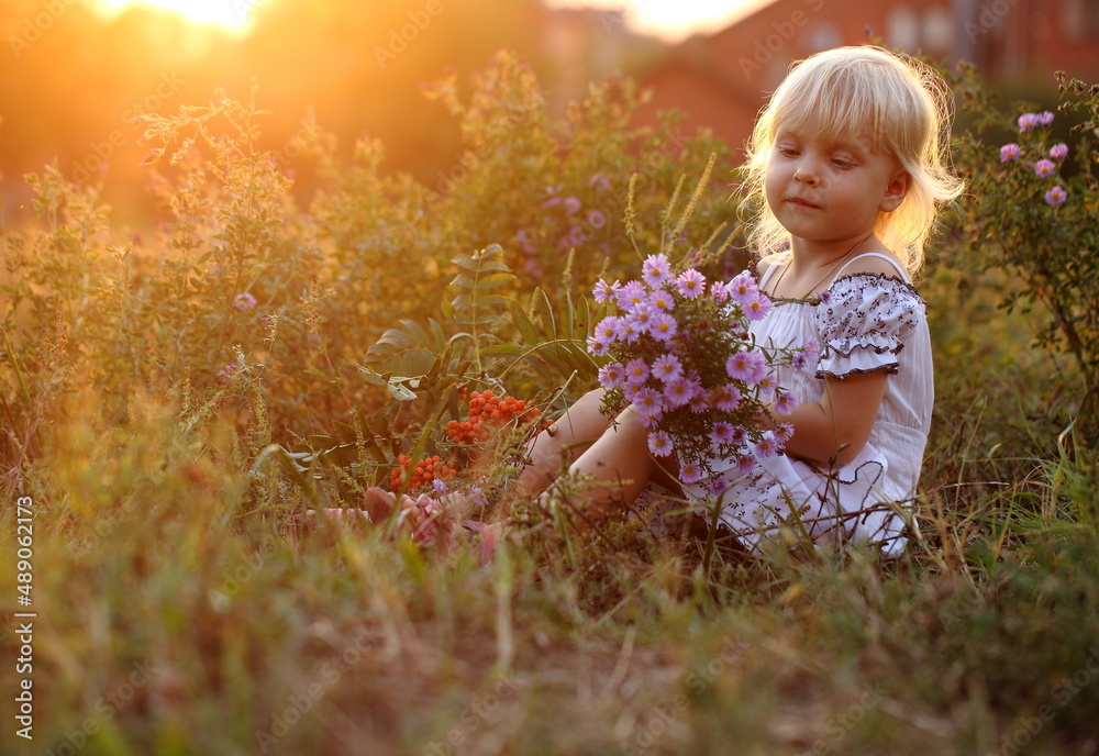 Girl with a bouquet of flowers in the park Girl with a bouquet of flowers in the park