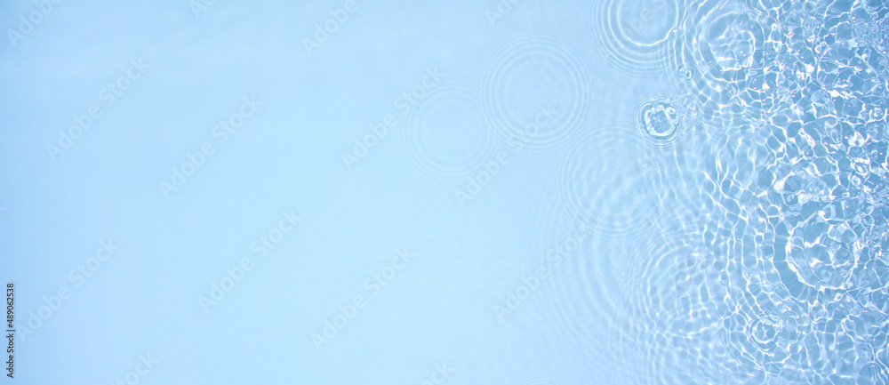 Transparent blue clear water surface texture with ripples, splashes and bubbles. Abstract summer banner background Water waves in sunlight with copy space Cosmetic moisturizer micellar toner emulsion Transparent blue clear water surface texture with ripples, splashes and bubbles. Abstract summer banner background Water waves in sunlight with copy space Cosmetic moisturizer micellar toner emulsion
