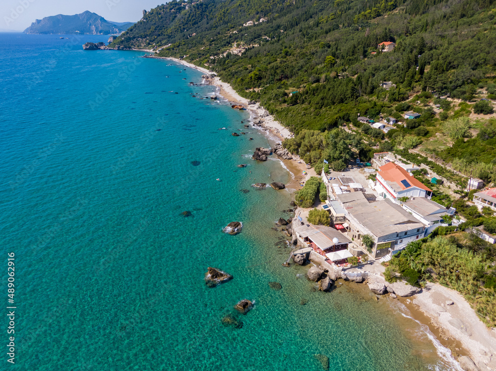 Aerial drone view of famous Agios Gordios beach in south corfu, Greece