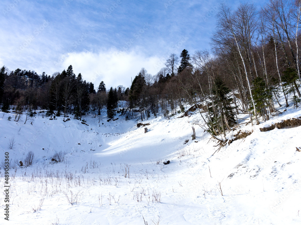 Fototapeta premium mountains, panoramic views of the mountainous terrain on a sunny winter day, walks and communication with nature.