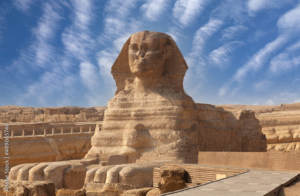 Great Sphinx of Giza near Cairo, Egypt. It is mythical creature with the head of man and the body of a lion. The face of the Sphinx appears to represent the pharaoh Khafre - obrazy, fototapety, plakaty 
