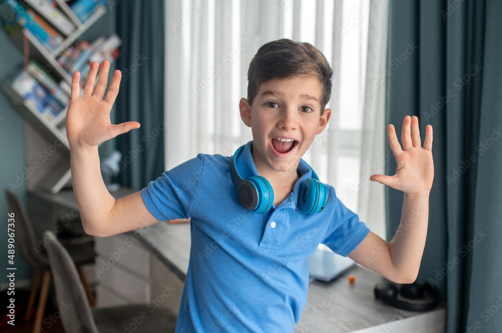 Cute kid expressing his surprise before the camera Cute kid expressing his surprise before the camera