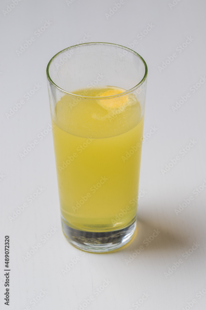 Fruit vitamin fizzy drink in a transparent glass. Fruit vitamin fizzy drink in a transparent glass.